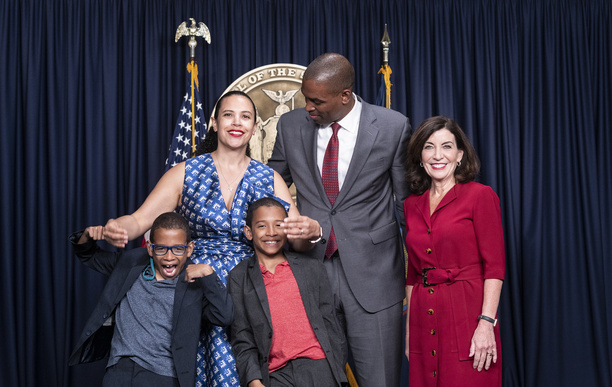 Antonio Delgado sworn in by judge Kevin Bryant as New York State Lieutenant Governor at New York City governor's office. To his right is Governor Kathy Hochul, to his left is wife Lacey Schwartz Delgado, both their sons celebrate in front. Ceremony was attended by Governor Kathy Hochul, Delgado wife Lacey Schwartz Delgado, their twin sons and other family members and officials.