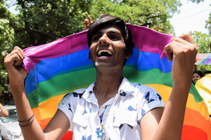 A Participant can be seen with a Pride Flag in a Pride March to celebrate Pride Month and spread awareness regarding the LGBTQ+ Community in New Delhi.