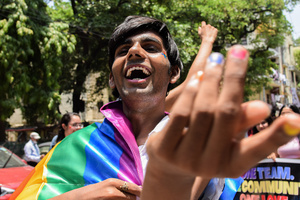 A Participant can be seen with a Pride Flag in a Pride March to celebrate Pride Month and spread awareness regarding the LGBTQ+ Community in New Delhi.
