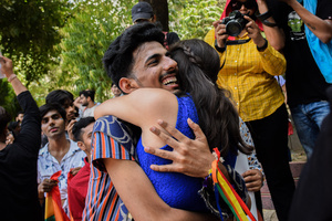 Participants hug each other in a Pride March to celebrate Pride Month and spread awareness regarding the LGBTQ+ Community in New Delhi.