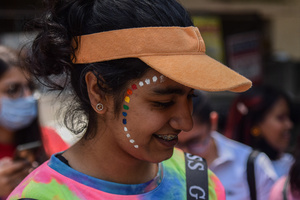 A participant can be seen with a tattoo on her face in a Pride March to celebrate Pride Month and spread awareness regarding the LGBTQ+ Community in New Delhi.