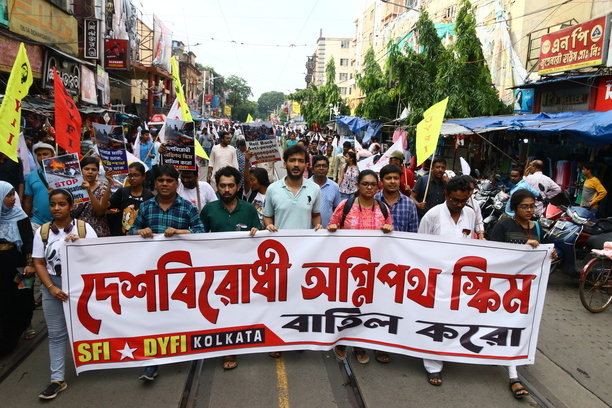 Activists of the DYFI (Democratic Youth Federation of India) and SFI (Students' Federation of India) hold placards and shout slogans against the government's new Agnipath recruitment scheme for the army, navy, and air forces during a protest in Kolkata.