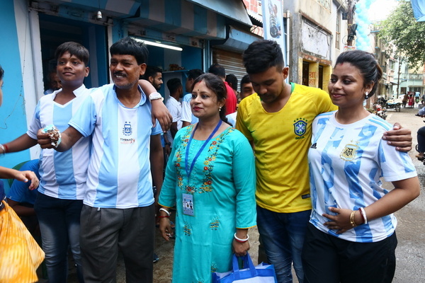 Indian fans of Argentina and Lionel Messi, celebrate his 35 birthday at a three-storey apartment painted in blue-and-white by Indian tea seller Shib Shankar Patra at Ichapore, some 35 km from Kolkata on June 24, 2022.