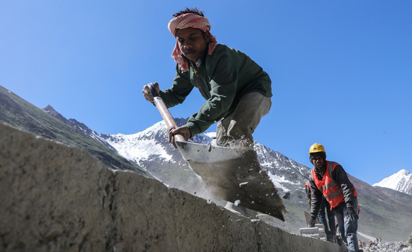 Workers work on a highway which lead to Zojila Pass, 108 kilometers east from Srinagar in Zojila, India. Zojila one of the dangerous mountain passes located in the Kashmir region which is the only road link between Kashmir and Ladakh which has strategic significance as Zojila Pass is situated at an altitude of 11,578 feet on the Srinagar-Kargil-Leh National Highway and remains closed during winters due to heavy snowfall and this year the pass is opened on March 19 after remaining closed for 73 days.