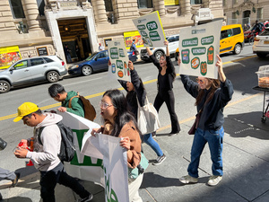 Demonstrators are holding pro-vendor rights signs in Lower-Manhattan, New York City to demand better laws and treatment for street vendors, on sept 29, 2022.
