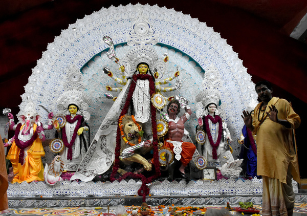 a priest stands in front of the durga idol of matri mandir safdarjung enclave after inauguration on sashti day.
