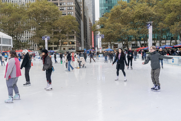 People visit winter village at Bryant Park to scate during holiday season. Scating rink surranded by holiday market and similar markets are open at Oculus, Union Square and Grand Central Terminal.