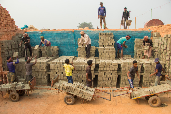 People are working hard in the brick field. This image was taken from Bosela, Bangladesh on December 30, 2022