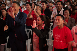 Paethongtarn Shinawatra (C), Chairman of the Engagement and Innovation Advisory Board of The Pheu Thai Party, and Srettha Thavisin (L), Chief Advisor to the Head of the Pheu Thai Family, Help Pheu Thai Party's candidate for the House of Representatives, during a campaign at Stadium one, Banthadthong Road, Pathum Wan district, Bangkok, Thailand, on March 24, 2023.
