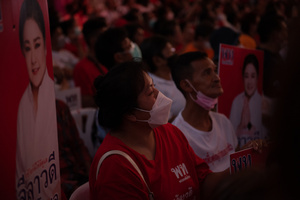 Supporters of the Pheu Thai Party, rally listen to the campaign and unveil Pheu Thai Party candidates for the House of Representatives in the Bangkok constituency at Stadium one, Banthadthong Road, Pathum Wan district, Thailand, on March 24, 2023.