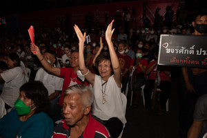 Supporters of the Pheu Thai Party, rally listen to the campaign and unveil Pheu Thai Party candidates for the House of Representatives in the Bangkok constituency at Stadium one, Banthadthong Road, Pathum Wan district, Thailand, on March 24, 2023.