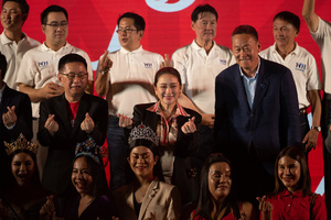 Paethongtarn Shinawatra (C), Chairman of the Engagement and Innovation Advisory Board of The Pheu Thai Party, and Srettha Thavisin (R), Chief Advisor to the Head of the Pheu Thai Family, Help Pheu Thai Party's candidate for the House of Representatives, during a campaign at Stadium one, Banthadthong Road, Pathum Wan district, Bangkok, Thailand, on March 24, 2023.