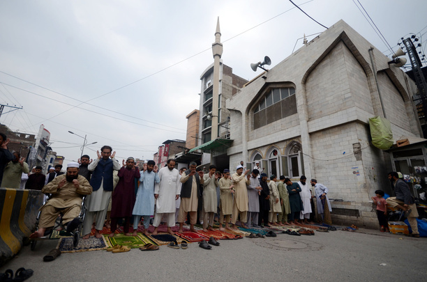 Pakistani Muslims perform the first Friday prayer in the holy month of Ramadan at Cantt Mosque.