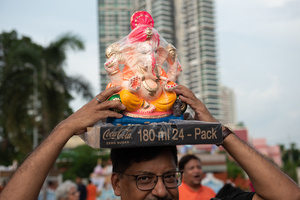 Devotees float a statue of Ganesha into the Chao Phraya River at Bhumibol Bridge, Rama 3 Road, on the last day of the 16th Shree Ganesha Festival in Bangkok, on September 24, 2023. organised by the Vishwa Hindu Parishad Association Thailand.