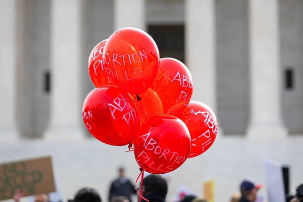 Demonstrators protest and argue outside the U.S. Supreme Court. On Tuesday, the same justices who reversed constitutional protection for abortion two years ago will hear arguments on whether to limit the use of mifepristone, a medication that's used in nearly two-thirds of all abortions nationally.