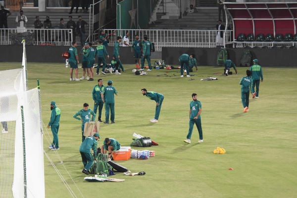 Pakistan's captain Babar Azam (C) speaks with teammates during practice session at the Rawalpindi Cricket Stadium in Rawalpindi on April 16, 2024. Babar Azam makes his return as Pakistan captain in a five-match Twenty20 series starting on April 18 against an understrength New Zealand with the World Cup weeks away.