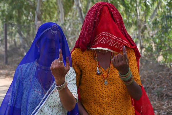People cast their votes during the first round of India's national election in Nagaur district, Rajasthan state. Nearly 970 million voters will elect 543 members for the lower house of Parliament for five years, during staggered elections that will run until June 1.