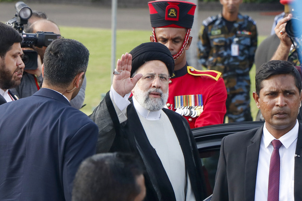 Iran's President Ebrahim Raisi waves upon arriving at Bandaranaike International Airport in Katunayake near Colombo on April 24, 2024. Raisi arrived in Sri Lanka on April 24 to inaugurate a power and irrigation project, unaccompanied by his interior minister who is being sought for arrest over a deadly 1994 bombing.
