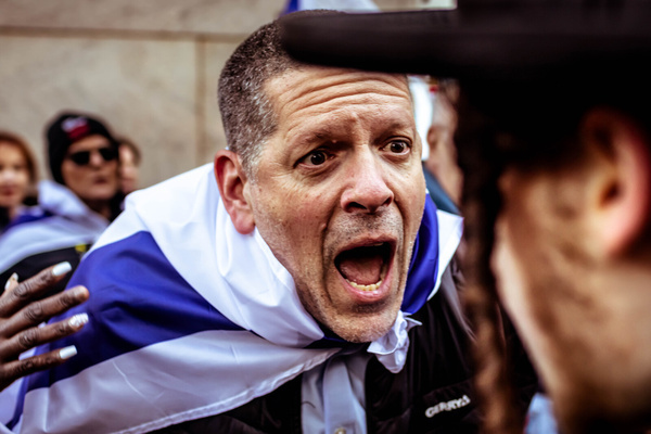 Pro-Israel Jews and pro-Palestine Jews trade insults during the United for Israel march outside of Columbia University. Israel supporters are reacting to the growing number of college campuses throughout the country whose student protesters are setting up pro-Palestinian tent encampments on school grounds.