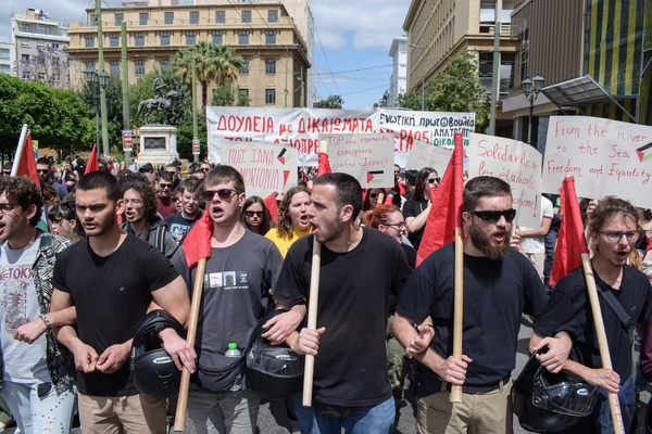 Protesters march during the International Wokers' Day rally. Thousands protest at “high prices and loss of wages that drive the society to a permanent impoverishment" in May Day rallies.