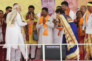 Prime Minister Narendra Modi is greeting supporters during an election campaign ahead of the Lok Sabha General Election at SAI Complex Ground in South Bardhaman District, India, on May 3, 2024