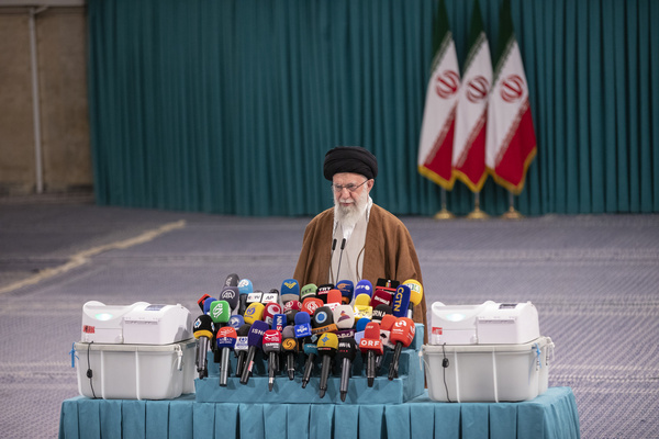 Iranian Supreme Leader Ayatollah Ali Khamenei speaks with media members after he voted for the parliamentary runoff elections.