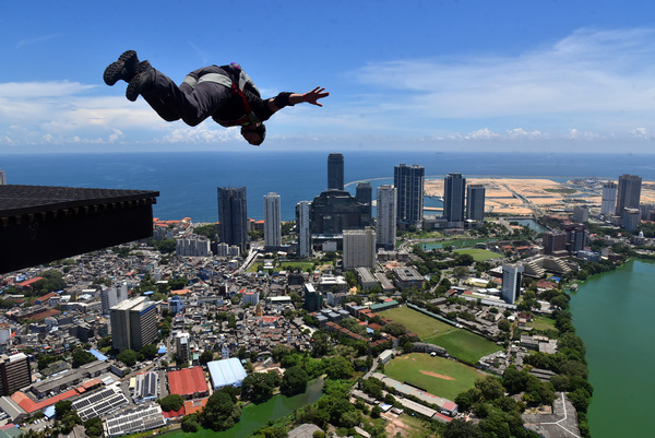 The Colombo Lotus Tower management company organized Base Jumping event, which is happening at Colombo Lotus Tower for three days. 35 International Base jumper exhibited their Skills. Lotus Tower, is a 351.5 m (1,153 ft) tall and located in Colombo, Sri Lanka