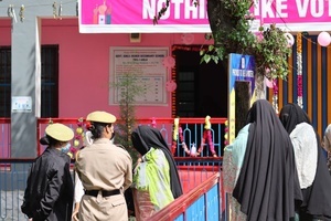 Kashmiri men and women take part in Lok Sabha Srinagar Parliamentary Constituency election on Monday 13 May. This is the first major election being held in Jammu and Kashmir after the abrogation of Article 370 and the bifurcation of the erstwhile state into two union territories of Jammu and Kashmir and Ladakh in 2019.
