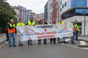 Avilés, Spain, May 16, 2024: One of the demonstration banners with "Fewer closures, more future, employment, investments" during the Demonstration for the future of Saint Gobain, on May 16, 2024, in Avilés, Spain.