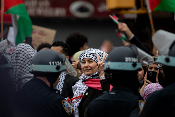 BROOKLYN, NEW YORK - MAY 18: A pro-Palestinian demonstrator holds up a peace sign while participating in a rally and march to commemorate the 76th anniversary of Nakba Day on Wednesday, May 18, 2024 in the Brooklyn borough of New York City. The Nakba, meaning 'catastrophe' in Arabic, is marked every year by Palestinians on May 15 to remember the expulsion of hundreds of thousands from their homes and lands in 1948 after the founding of Israel. (Photo by Michael Nigro)
