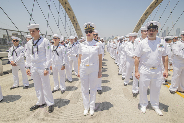 About 500 Navy sailors marched across the Sixth Street Viaduct in Downtown Los Angeles on Monday, May 27, for a Memorial Day tribute to those who died while serving in the United States Armed Forces. The walk to pay tribute to fallen U.S. military personnel began at noon on the Boyle Heights side of the viaduct, with sailors forming 10 rows abreast and 50 deep, according to Branimir Kvartuc, the media representative for LA Fleet Week. Members of the Navy, Coast Guard and other military branches had been in town for the past several days to celebrate Los Angeles Fleet Week. The main footprint for Fleet Week was in San Pedro, at the LA Harbor, where thousands of civilians converged over the long Memorial Day weekend to take tours of ships, examine military equipment and honor the Armed Forces. But the service members also spread out across the region, visiting Disneyland, catching ballgames at Dodger Stadium and enjoying barbecue in Mission Hills. And, on Monday, they converged on Downtown LA to honor their fallen comrades.