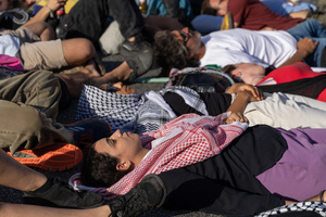 A group of students lay down on the ground in a sign of solidarity with the Palestinian population who died in Rafah due to attacks by the Israeli army