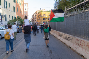 A child waves a Palestinian flag during the protest of Palestinian students in Rome