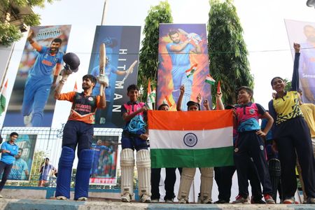 Budding Cricketers of Patuli Cricket Academy cheers for the Indian Team , A day before the ICC Men's Cricket World Cup 2023 final between India and Australia in kolkata,India on November 18,2023. Many Cricket fans offer special prayers for the Indian team and especially for their star player Virat Kohli.