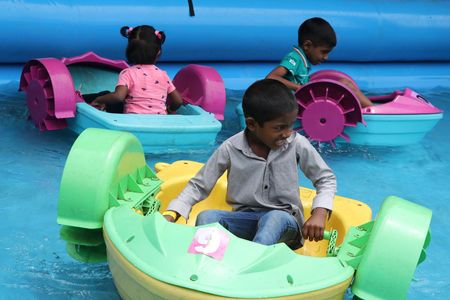 Children participate in fun activities during an event held at the airport premises in Ratmalana. The event was organized to coincide with the World Children's Day.