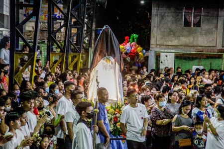 Catholic devotees attend the traditional Salubong followed by Easter Sunday mass at Barangay Bagong Silangan in Quezon City.