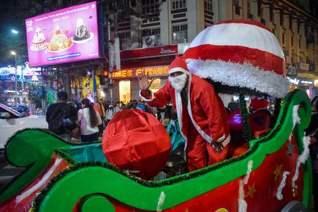 A person dresses up like Santa Claus as a part of the Kolkata Christmas Festival in Kolkata.