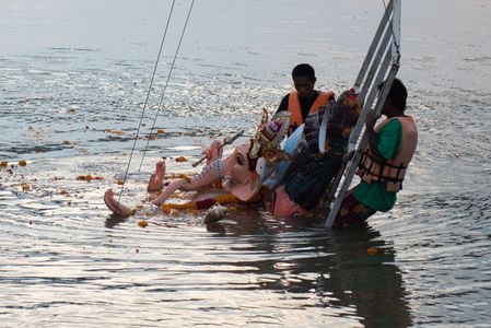 Devotees float a statue of Ganesha into the Chao Phraya River at Bhumibol Bridge, Rama 3 Road, on the last day of the 16th Shree Ganesha Festival in Bangkok, on September 24, 2023. organised by the Vishwa Hindu Parishad Association Thailand.