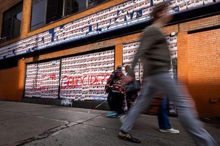 People walk past images of Israeli hostages glued on to a Manhattan street corner. Posters of hostages taken captive by Hamas during the terror attack on Israel on October 7th have been defaced throughout the city and then often replaced with new flyers. Israel and Hamas agreed to a further extension to a truce that has lasted nearly a week, which promised the release of more Israeli hostages held in Gaza, as well as the release of Palestinian prisoners held in Israeli jails.