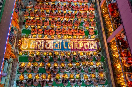 Every year thousands of Hindu devotees gather in front of Shri Shri Lokenath Brahmachari Ashram temple for the Kartik Brati or Rakher Upobash religious festival in Swamibagh, Dhaka, Bangladesh. Faithful sit in front of candles light ( named locally as Prodip ) and absorb in prayer.

Lokenath Brahmachari who is called Baba Lokenath was an 18th Century Hindu saint and philosopher in Bengal. Hindu worshipers fast and pray in earnest to the gods for their favors during the traditional ritual called Kartik Brati or Rakher Upobash.