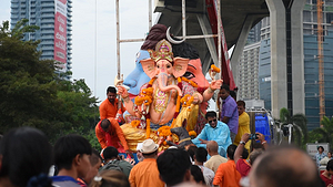 Devotees float a statue of Ganesha into the Chao Phraya River at Bhumibol Bridge, Rama 3 Road, on the last day of the 16th Shree Ganesha Festival in Bangkok, on September 24, 2023. organised by the Vishwa Hindu Parishad Association Thailand.