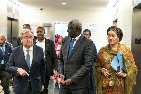 Secretary-General Antonio Guterres, Chairperson of the African Union Commission Moussa Faki and Amina J. Mohammed leave after the press briefing at the United Nations Headquarters.