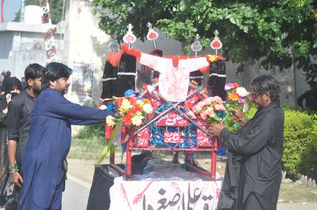 Pakistani Shia Muslims participate in a religious procession. Pakistani Shia Muslims held religious processions across the country on the 40th day of mourning following the death anniversary of Imam Hussain, the grandson of the Prophet of Islam, along with his close relatives and supporters at the Battle of Karbala in modern-day Iraq in 680 AD.