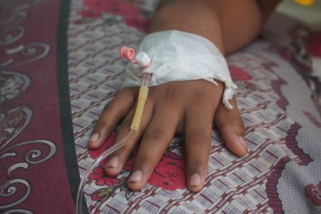 Ahad Hosen (15), a dengue patient, receives treatment at the Suhrawardy Medical College hospital. The number of dengue patients started increasing before the season started in Bangladesh.