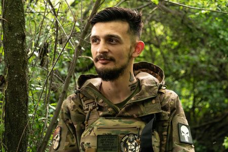 Yuriy, commander of battalion of 57th artillery brigade of Ukrainian Army Forces poses in undisclosed location of Donbas of Ukraine where his unit battles Russian invasion. 57th brigade was named after Kost Hordiyenko, Zaporozhian Cossack who was an ally of famous Ukrainian hero Ivan Mazepa.