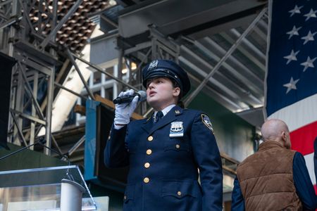 Police Officer Cannon performs American Anthem during ceremony for final steel beam wrapped with the American flag and signed by workers and officials raised at JP Morgan Chase new global headquarters in New York. New building will be ready for occupation in 2025 and will be home for about 14000 employees. The project created 8000 union jobs across 40 local unions. The event was attended by union workers, JPMorgan Chase Chairman & CEO Jamie Dimon, Governor Kathy Hochul, Mayor Eric Adams, President of Building and Construction Trades Council of Greater New York Gary LaBarbera, CEO of Banker Steel Don Banker, architect Norman Foster.