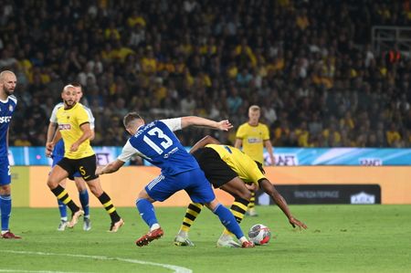 Ristovski (no 13) of GNK Dinamo stops effort of Garcia (no 7) of AEK.