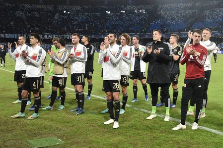 Union Berlin's players greet their fans at the end of the match during the Uefa Champions League match between SSC Napoli vs FC Union Berlin at Diego Armando Maradona Stadium on November 8,2023 in Naples , italy