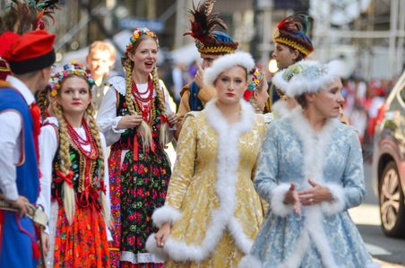 Members of the Polonaise Folk Dancers march along Fifth Avenue during the annual Pulaski Day Parade in New York City.
