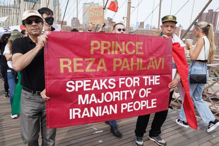 Hundreds of people rally and march across Brooklyn Bridge on the first anniversary of the murder of Mahsa Jina Amini in Iran after being arrested for allegedly not wearing the hijab properly.